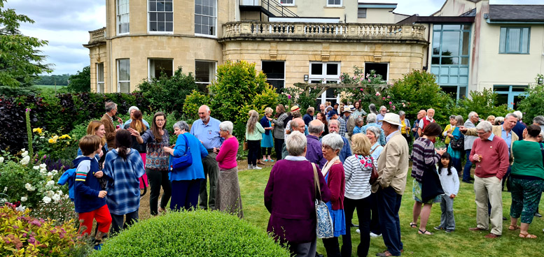 The partygoers gather, while music plays